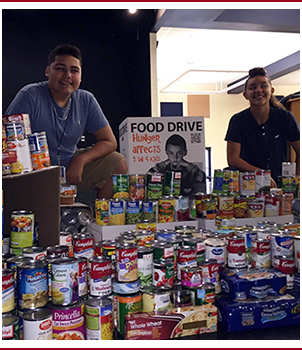 students display food drive items