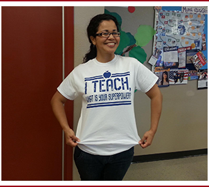 Teacher poses in a hallway